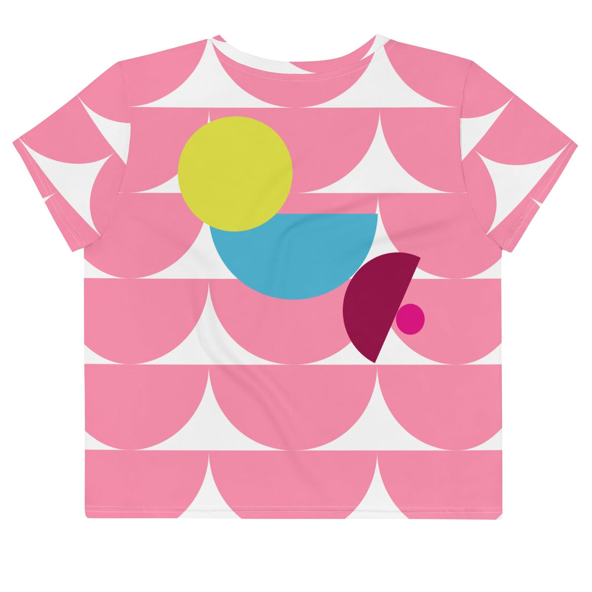 Good Wishes 365 pink crop tee with a vibrant geometric mushroom-inspired pattern in yellow, blue, and magenta.