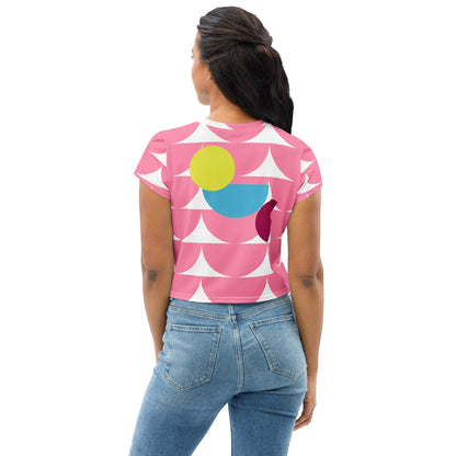 Good Wishes 365 pink crop tee with geometric mushroom pattern worn by a woman with blue jeans, back view.