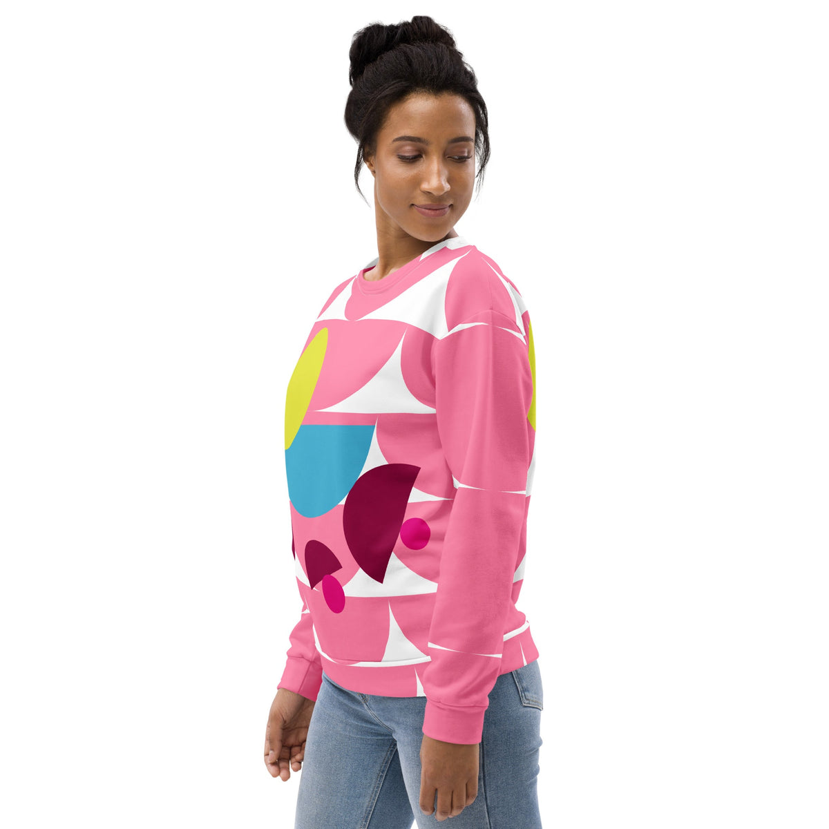 Good Wishes 365 pink recycled sweatshirt with geometric mushroom graphic worn by a woman looking over her shoulder