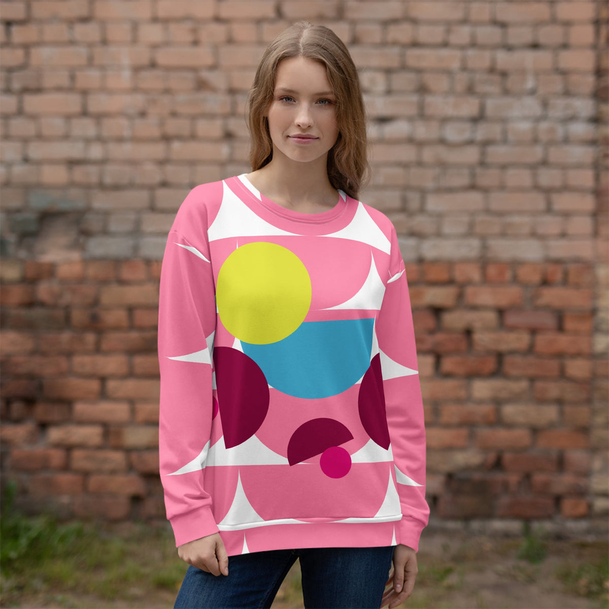 Good Wishes 365 pink recycled sweatshirt featuring a vibrant geometric mushroom graphic print on a model