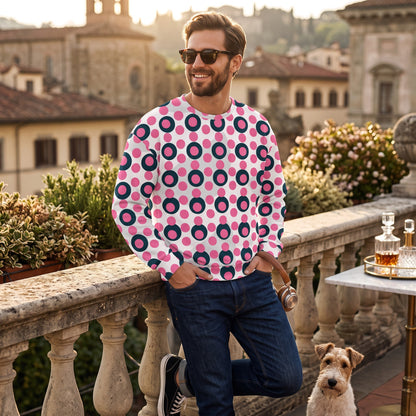 Good Wishes 365 unisex sweatshirt with rose pink and charcoal polka dot print worn by a man on a sunny terrace
