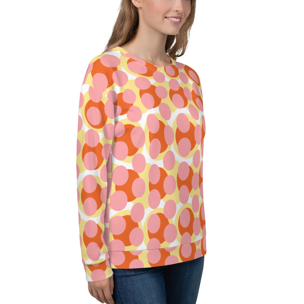 Good Wishes 365 recycled sweatshirt featuring a 70s pop art pink, orange, and yellow geometric print on a woman