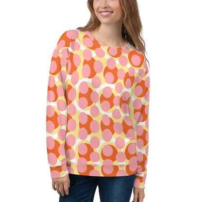 Good Wishes 365 recycled sweatshirt with a 70s pop art pink, orange, and yellow geometric print on a smiling woman