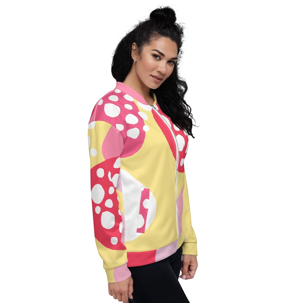 Good Wishes 365 unisex bomber jacket with a vibrant pink and yellow abstract strawberry print on a model