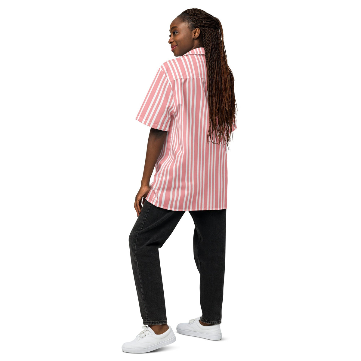 Good Wishes 365 pink and white vertical striped oversized resort shirt worn by a woman with black jeans and sneakers.