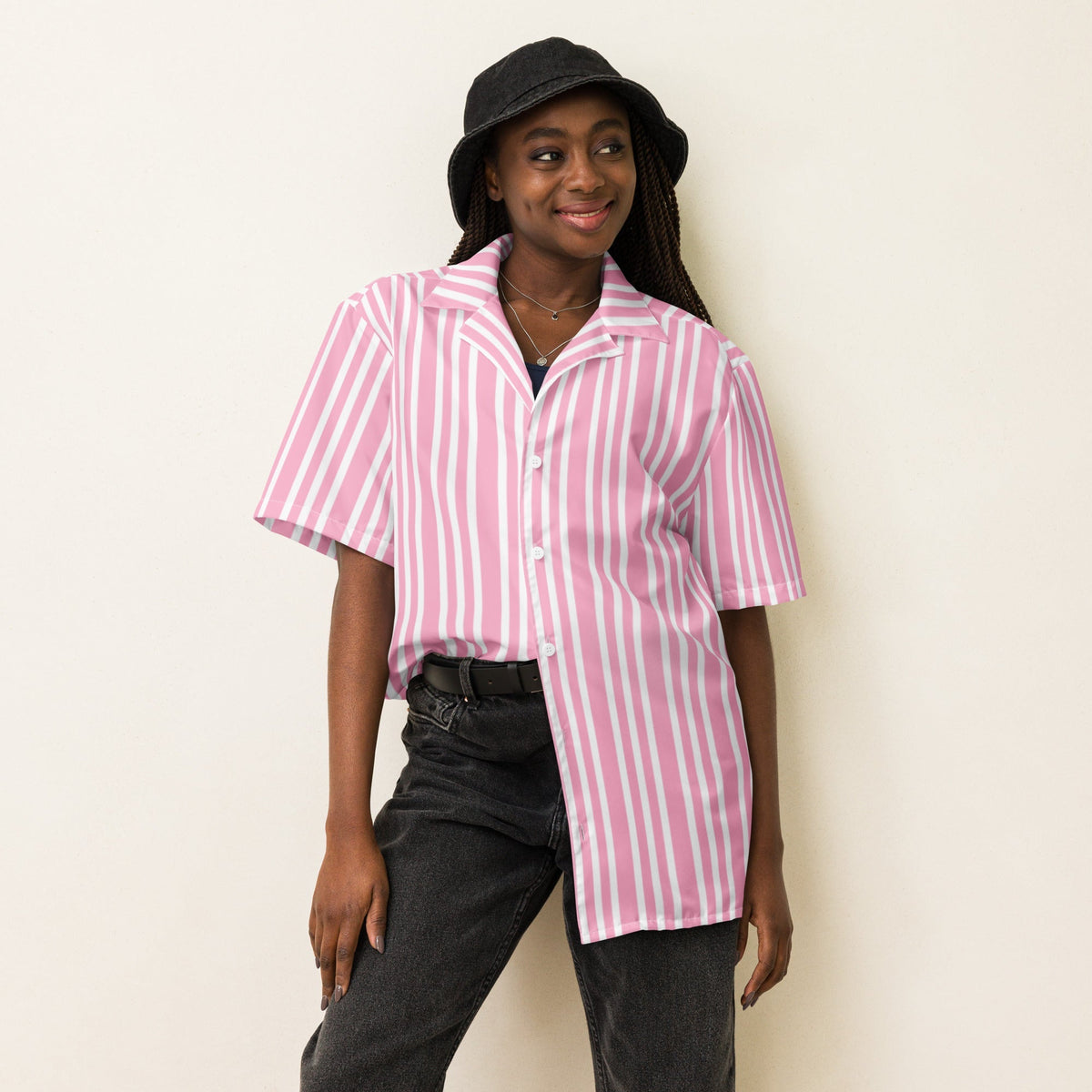 Good Wishes 365 pink and white striped short sleeve button-up shirt with camp collar worn by a woman in a bucket hat.