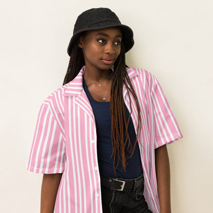 Good Wishes 365 pink and white striped short sleeve button-up shirt worn open over a dark tank top by a model.