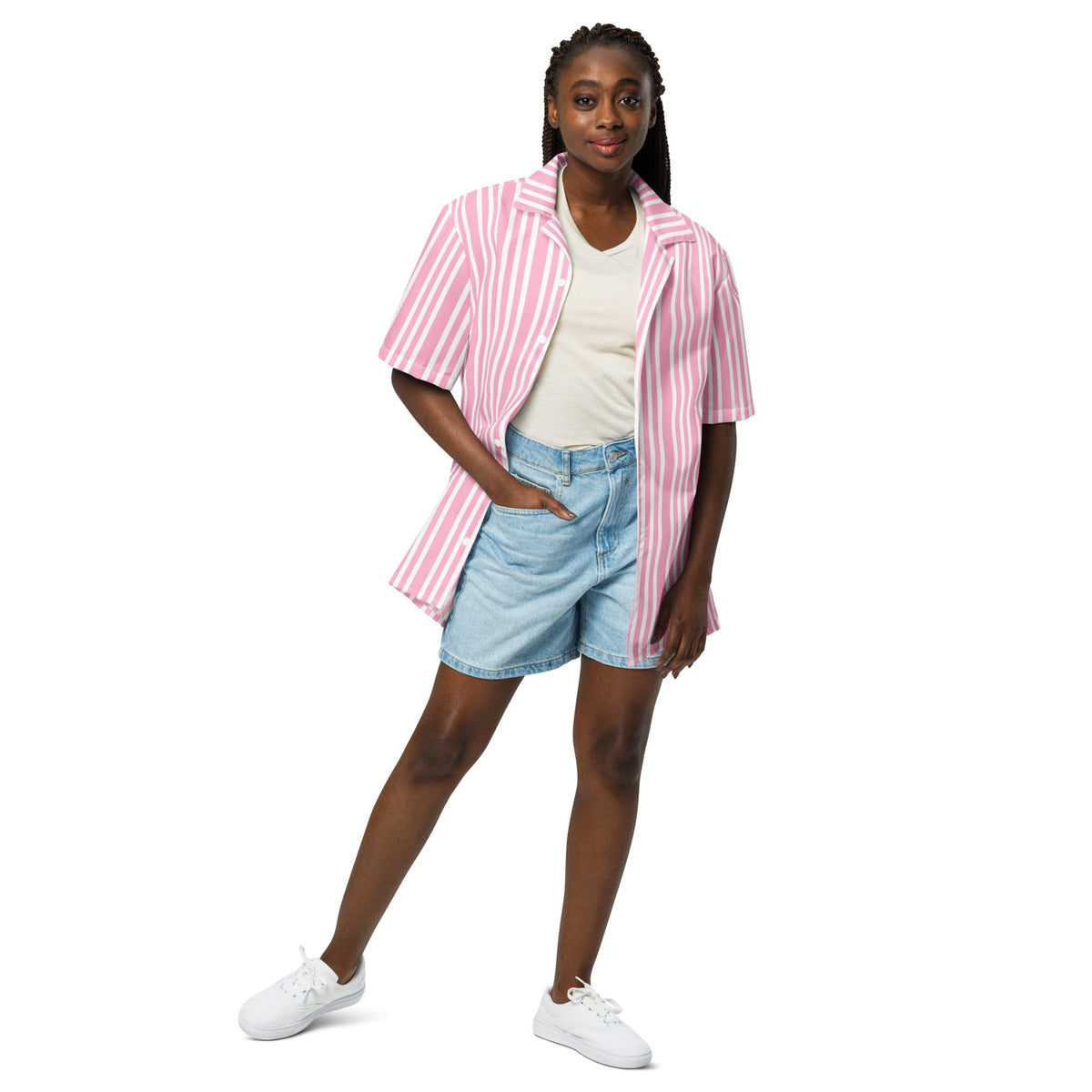 Good Wishes 365 model wearing a pink and white striped short sleeve button-up shirt with denim shorts and sneakers.