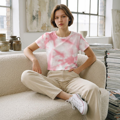 Good Wishes 365 women's pink tie-dye crop tee in premium stretch jersey worn by a model on a textured sofa