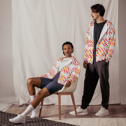 Good Wishes 365 unisex zip hoodie with pink and yellow geometric print worn by a woman sitting and a man standing