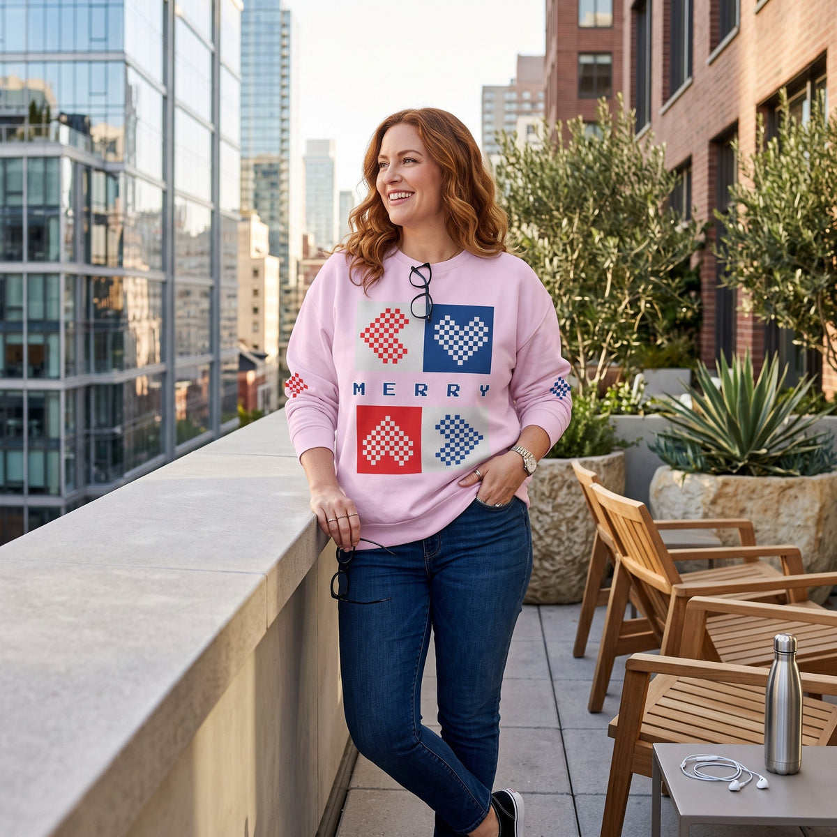 Good Wishes 365 light violet-lavender recycled unisex sweatshirt with pixelated Merry hearts print on a city balcony