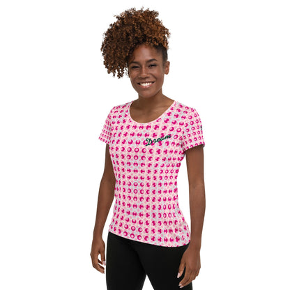 Good Wishes 365 athletic t-shirt with pink and violet polka dot print and Dream text on a smiling woman