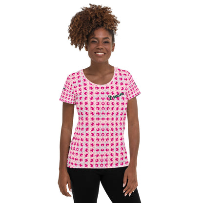 Good Wishes 365 women's athletic t-shirt with a pink polka dot print and Dream text on a smiling model