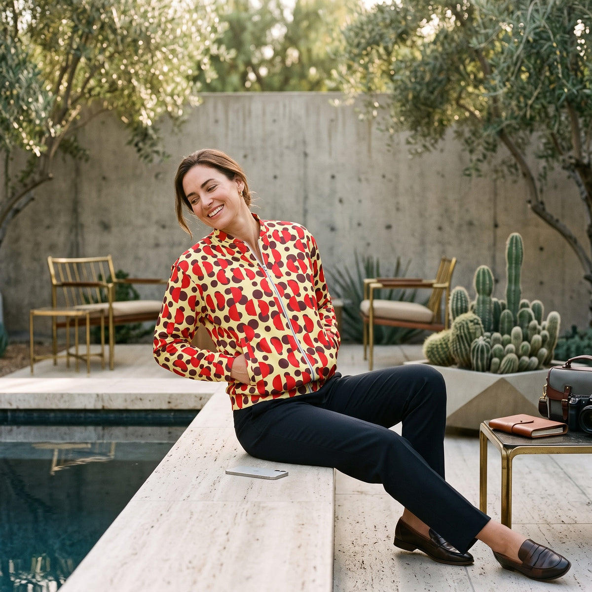 Good Wishes 365 unisex bomber jacket with brown polka dots and red semi-circles, featuring a silver zipper and fleece.
