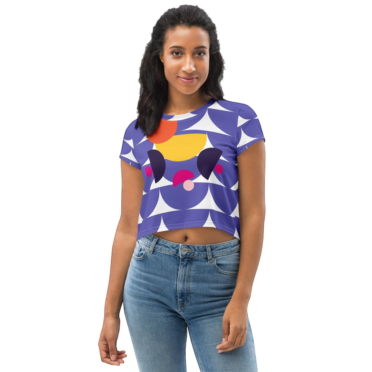Good Wishes 365 purple crop tee with geometric mushroom graphic worn by a smiling woman with blue jeans