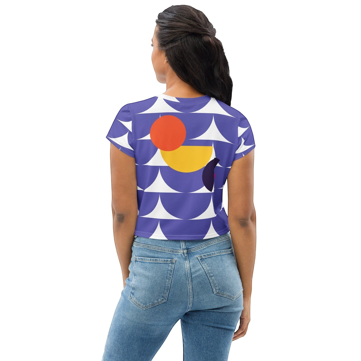Good Wishes 365 purple crop tee with geometric mushroom graphic worn by a woman, back view with blue jeans