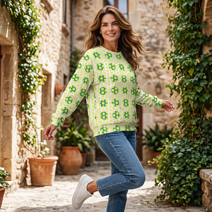 Good Wishes 365 women's recycled sweatshirt with yellow and green 70s pop art geometric print in a stone alleyway