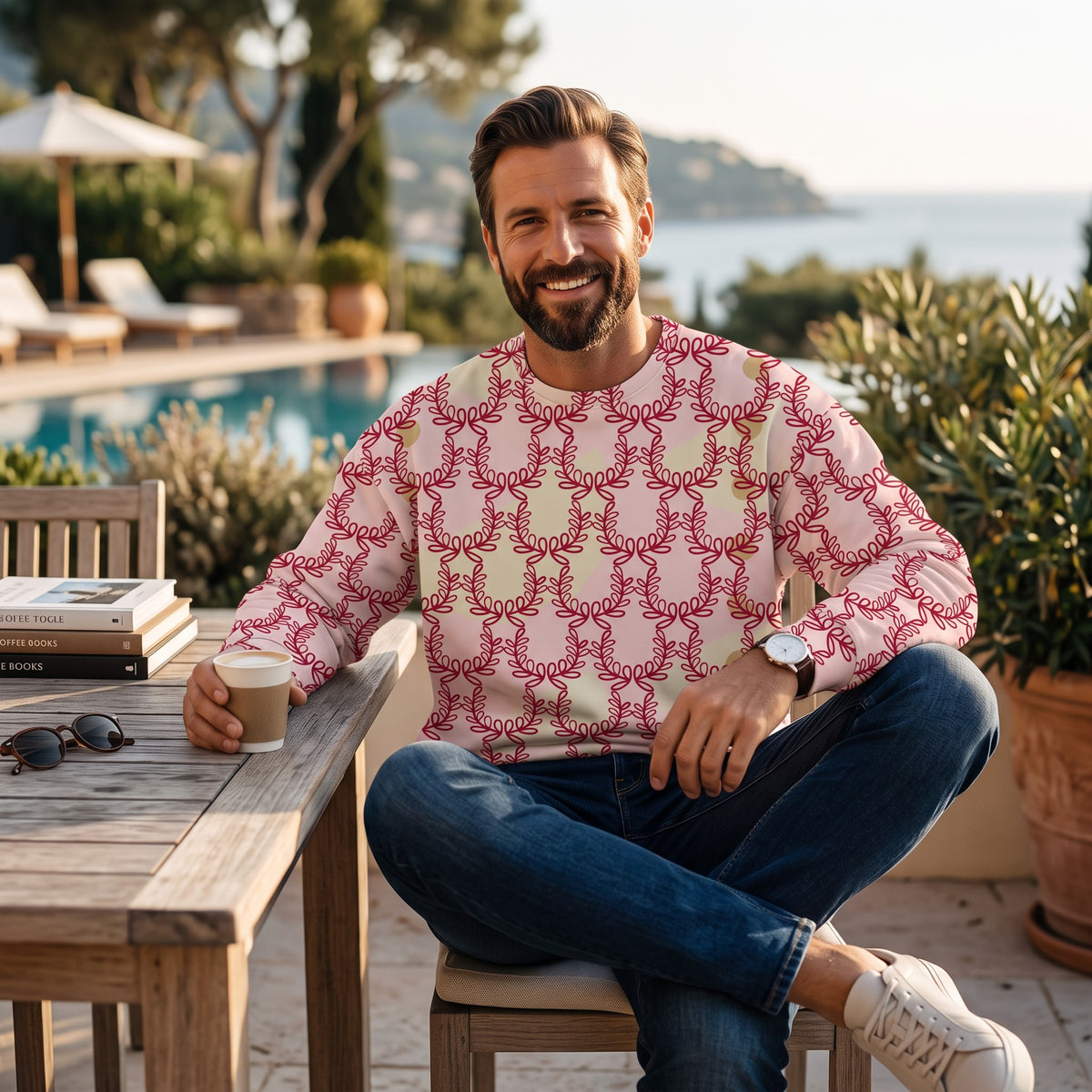 Good Wishes 365 unisex sweatshirt in misty rose with a deep red laurel leaf crown print worn by a smiling man outdoors