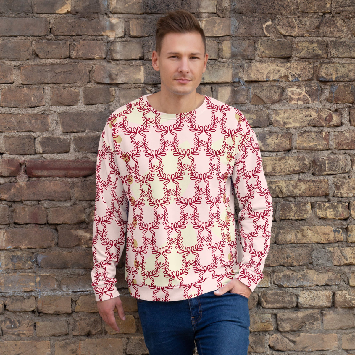 Good Wishes 365 unisex recycled sweatshirt in misty rose with a deep red laurel leaf crown print worn by a man