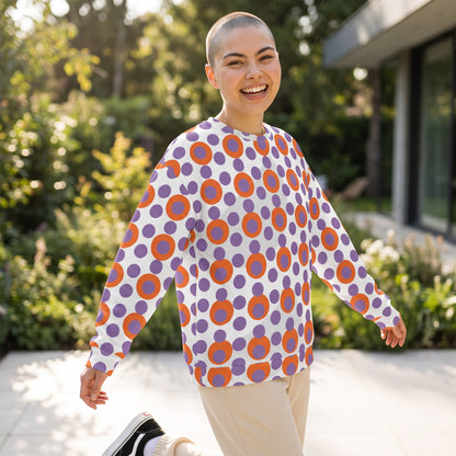 Good Wishes 365 recycled sweatshirt with 70s pop art orange and purple polka dot print on a smiling woman outdoors