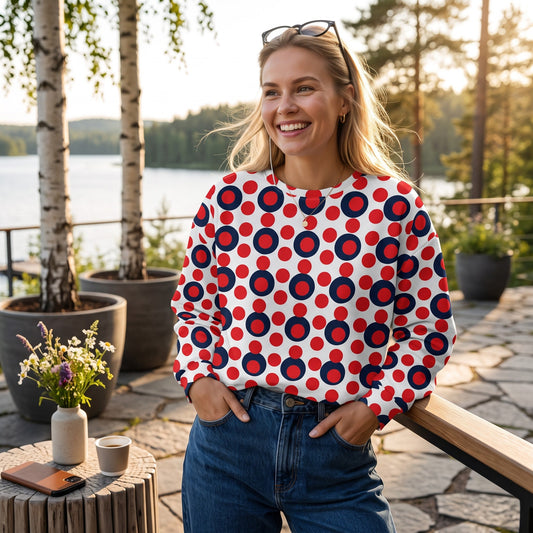 Good Wishes 365 recycled sweatshirt featuring a 70s pop art red and navy polka dot print on a woman outdoors