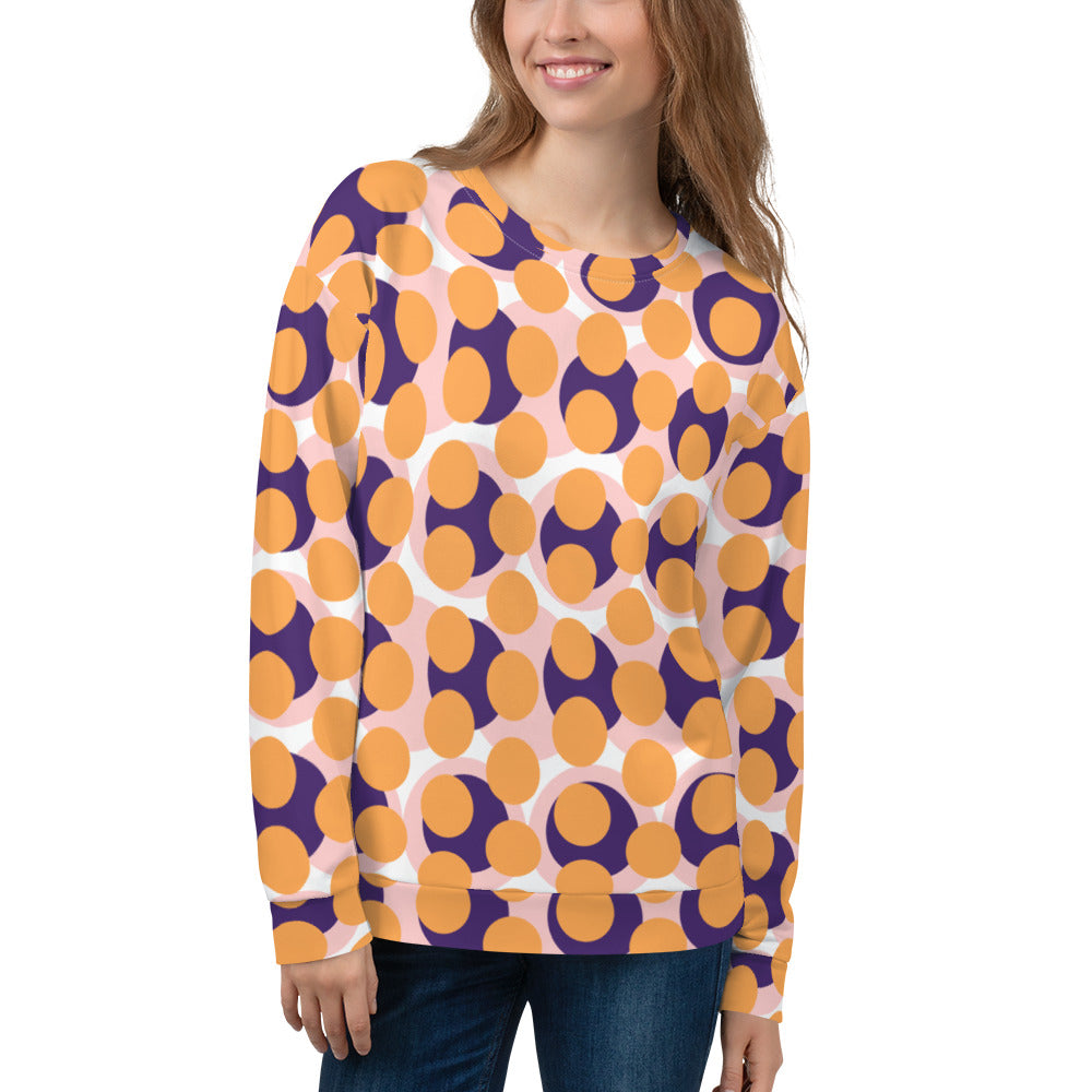Good Wishes 365 women's recycled sweatshirt with a 70s pop art orange, purple, and pink geometric circle pattern.