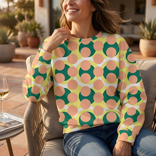 Good Wishes 365 recycled sweatshirt with 70s pop art geometric print in pink, yellow, and green on a smiling woman.