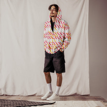 Good Wishes 365 recycled zip hoodie with pink and yellow geometric lines, worn by a man with black denim shorts.