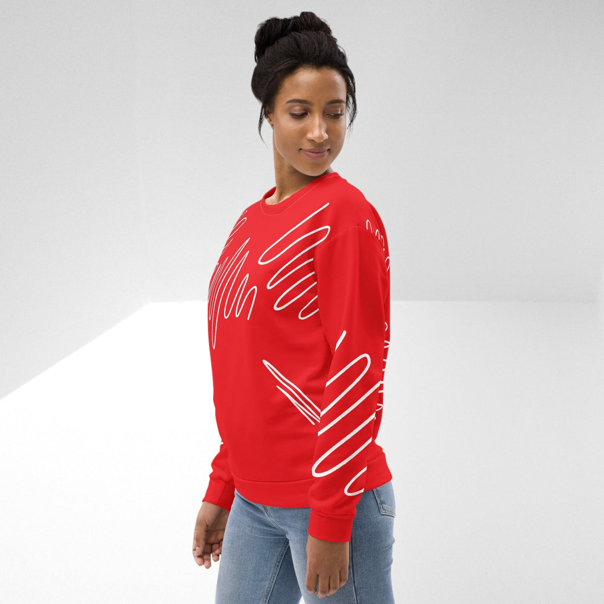 Good Wishes 365 red recycled sweatshirt with white abstract scribble lines worn by a woman in jeans