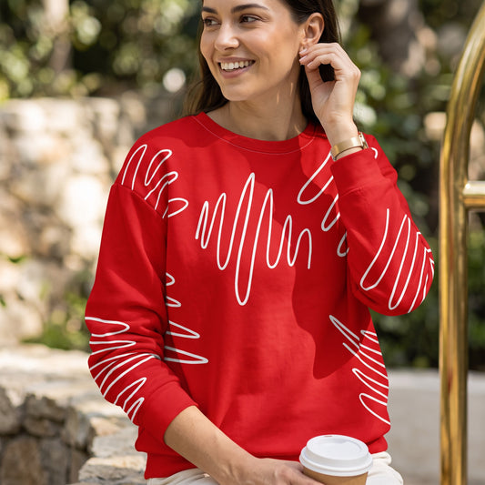 Good Wishes 365 red recycled sweatshirt featuring a white abstract scribble pattern, worn by a smiling woman outdoors.