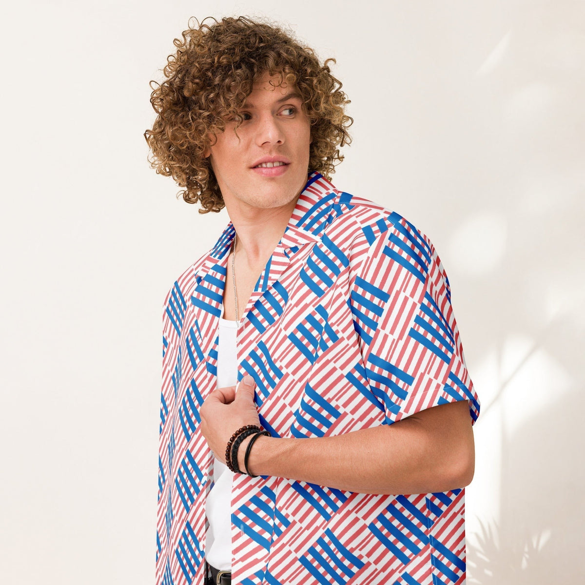 Good Wishes 365 men's oversized short-sleeve button shirt with a red and blue geometric love pattern on white fabric.