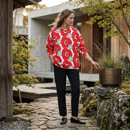 Good Wishes 365 unisex sweatshirt with red and gray floral print, crew neck, and ribbed cuffs worn by a woman outdoors.