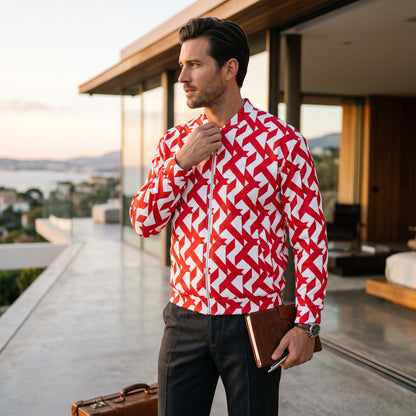 Good Wishes 365 unisex bomber jacket with red and white geometric maze print, worn by a man on a modern balcony.