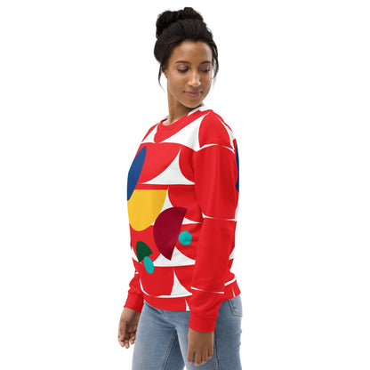 Good Wishes 365 red recycled sweatshirt with geometric mushroom all-over print worn by a woman in jeans