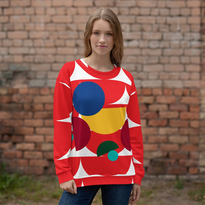 Good Wishes 365 red recycled sweatshirt with all-over geometric mushroom print worn by a woman against a brick wall