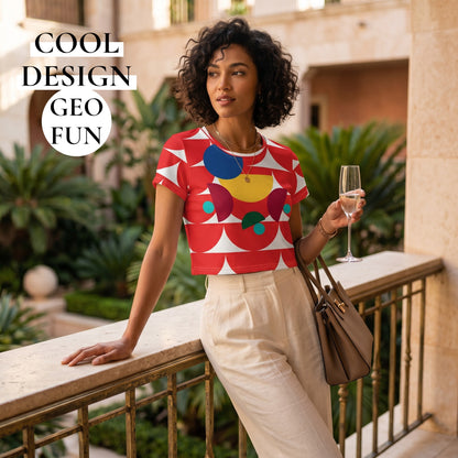 Good Wishes 365 red geometric mushroom print crop tee worn by a woman holding a glass on a balcony