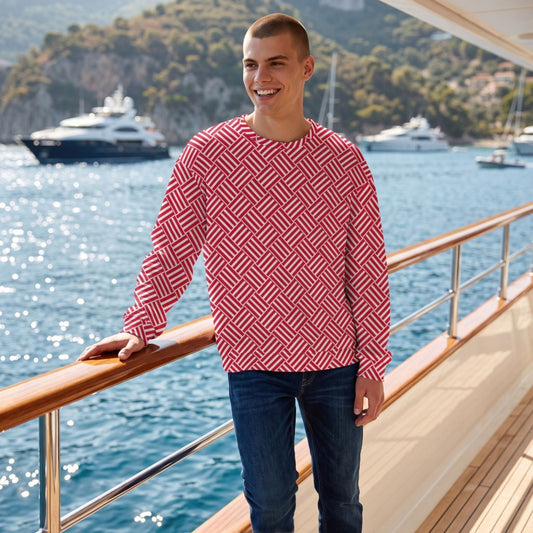 Good Wishes 365 unisex sweatshirt with red and white geometric basketweave print worn by a man on a yacht deck.