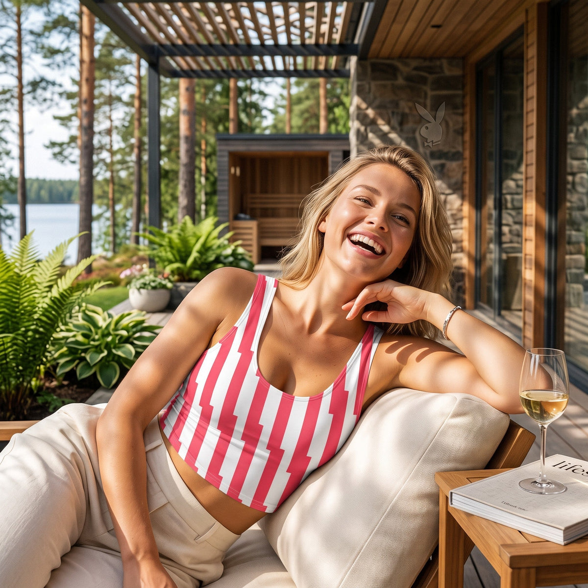 Good Wishes 365 red and white glitch stripe crop top worn by a smiling woman on a sunlit patio with a glass of wine