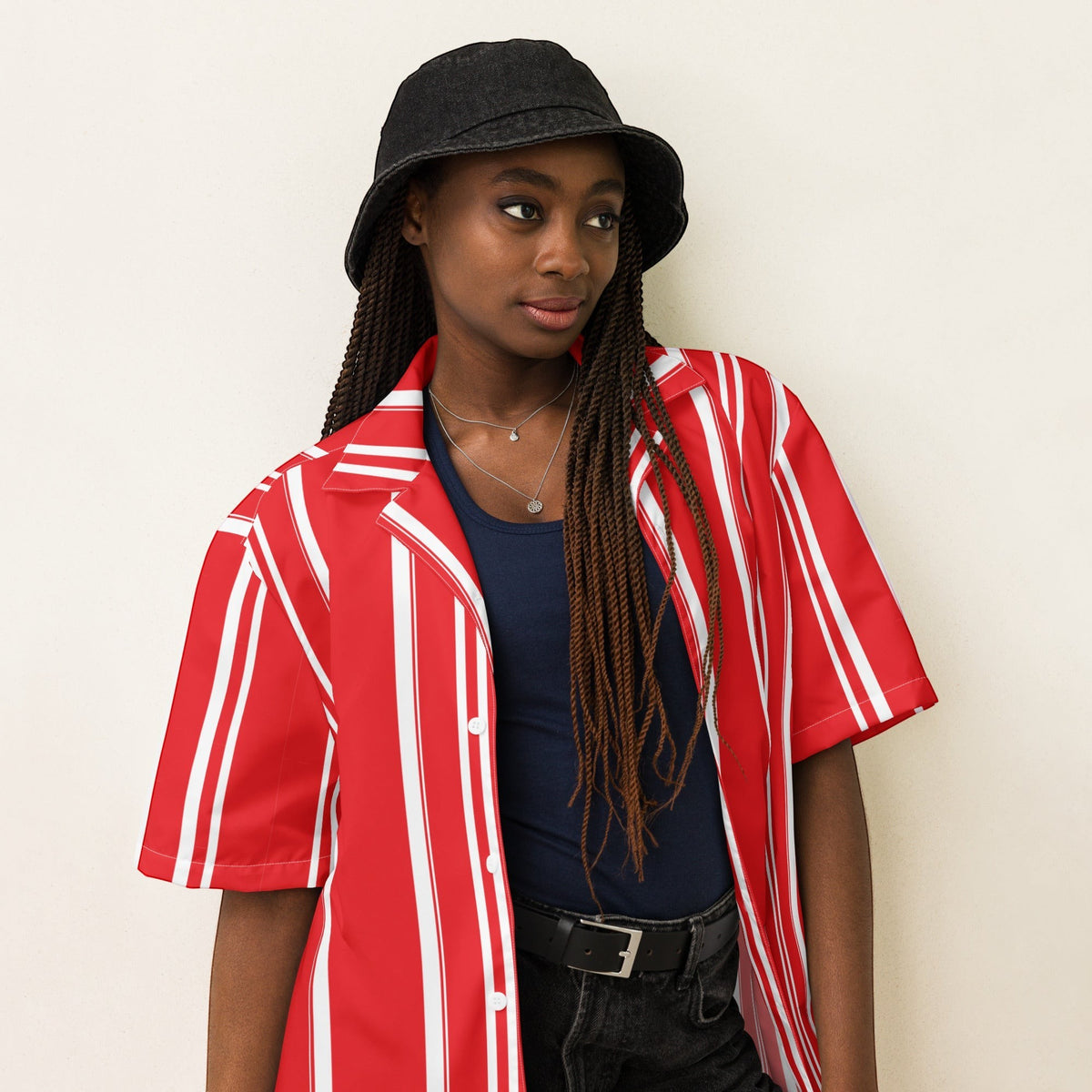 Good Wishes 365 red and white vertical striped short sleeve button-down shirt worn over a navy top with a black bucket hat