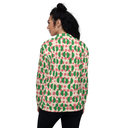 Back view of a woman wearing a Good Wishes 365 bomber jacket with a cream, pink polka dot, and green semi-circle print.