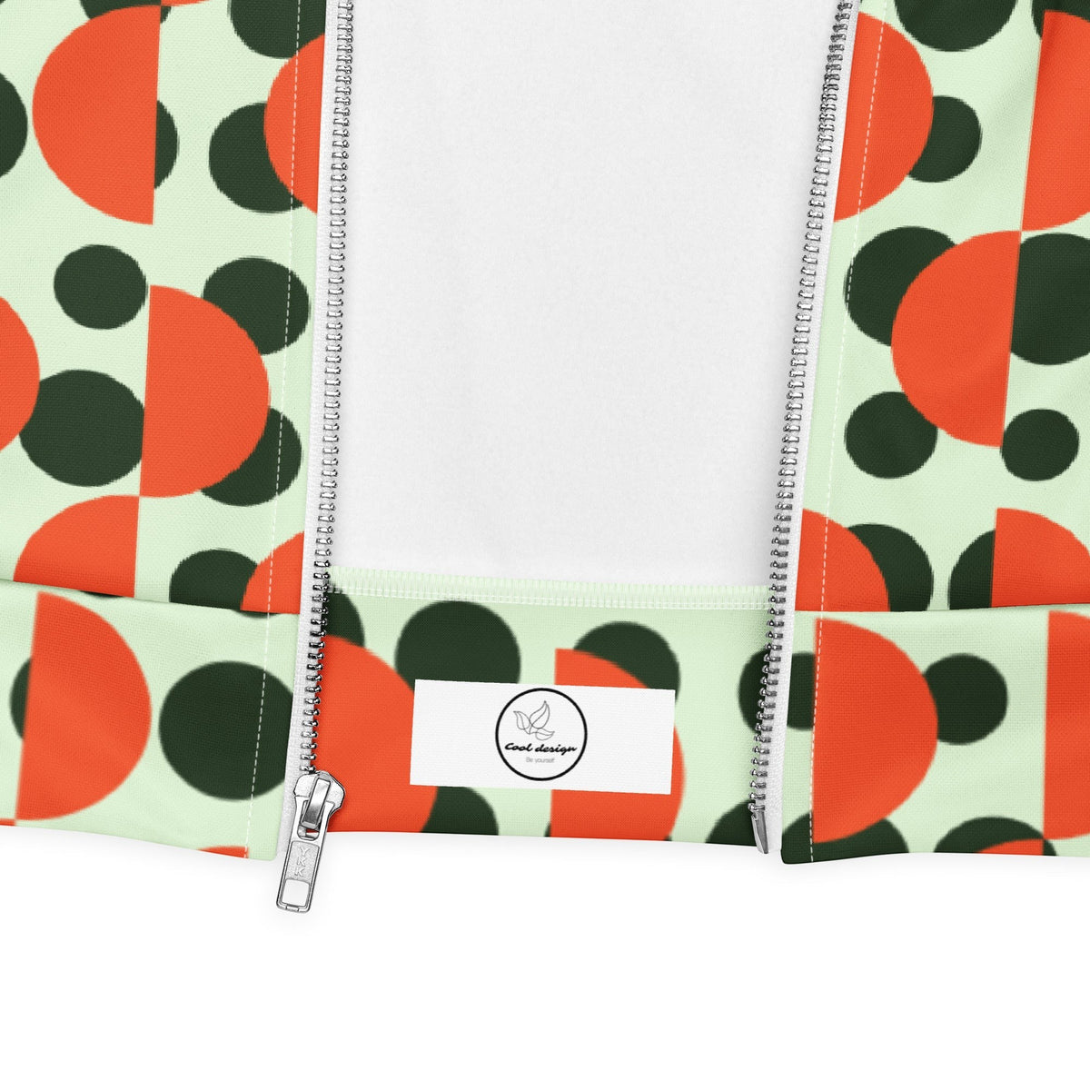 Good Wishes 365 bomber jacket with mint green background, dark green polka dots, and orange semi-circle pattern