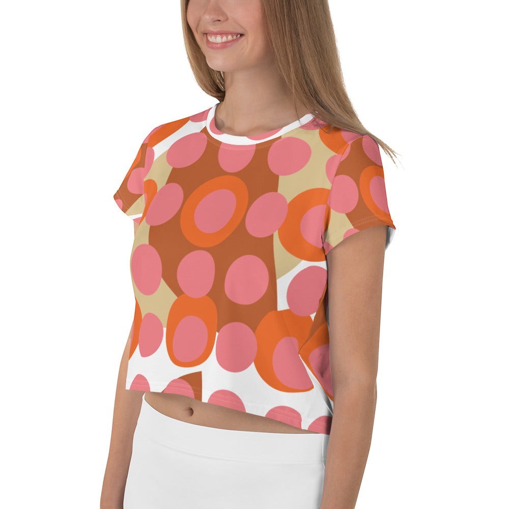 Good Wishes 365 retro mod polka dot crop tee in pink, orange, and terracotta on a model