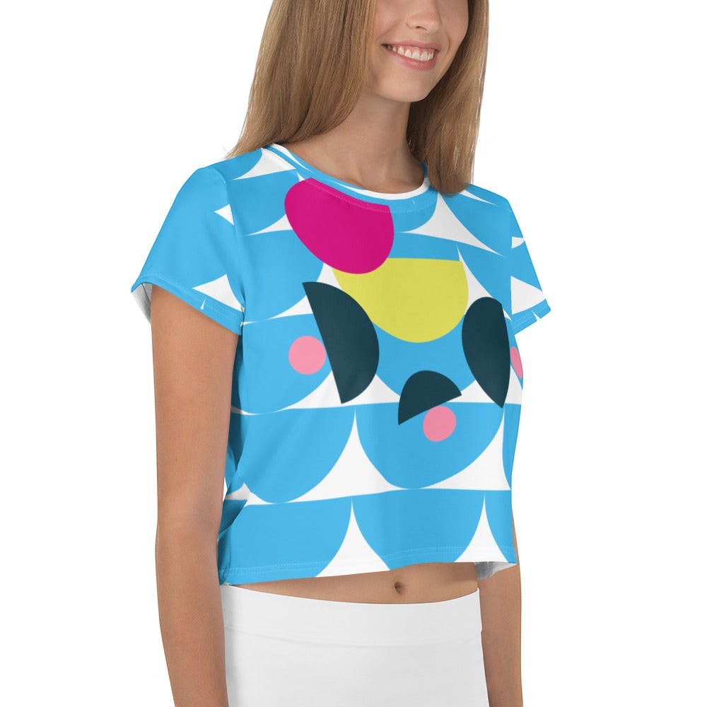 Good Wishes 365 sky blue crop tee with abstract geometric mushroom print in pink and yellow on a smiling model