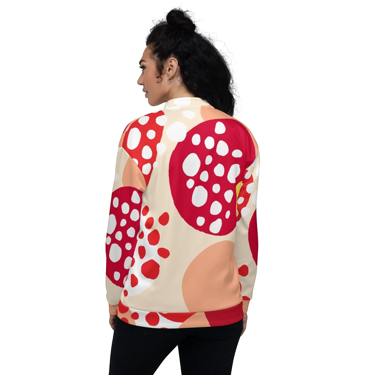 Good Wishes 365 unisex bomber jacket with a red, peach, and yellow strawberry print, back view on a woman.