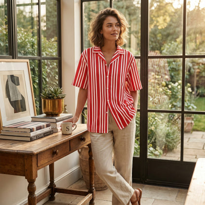 Good Wishes 365 unisex red and white striped button-down shirt with an oversized fit, worn by a woman indoors.