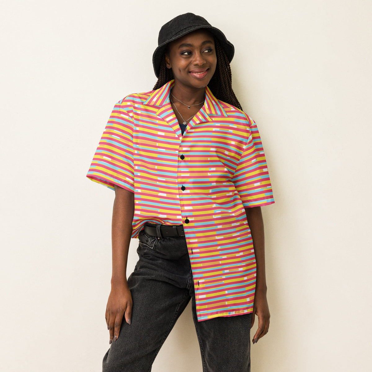 Good Wishes 365 model wearing a dark pink, yellow, and blue striped short sleeve button-up shirt with a camp collar.