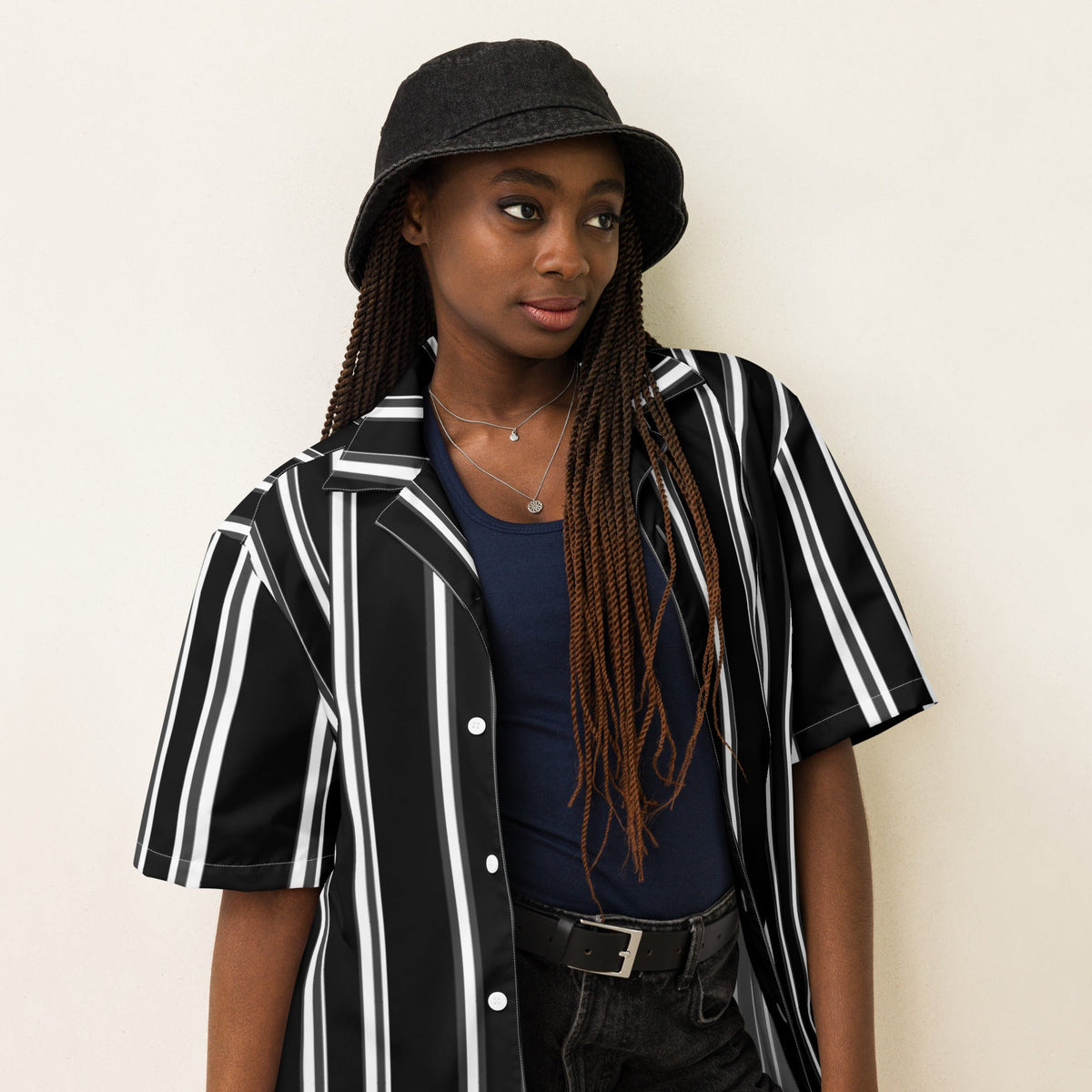 Good Wishes 365 black and white vertical striped short sleeve button-up shirt with UPF50+ protection on a model.
