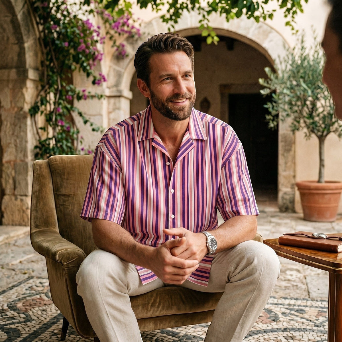 Good Wishes 365 men's short sleeve button shirt with purple and pink vertical stripes and a relaxed camp collar.