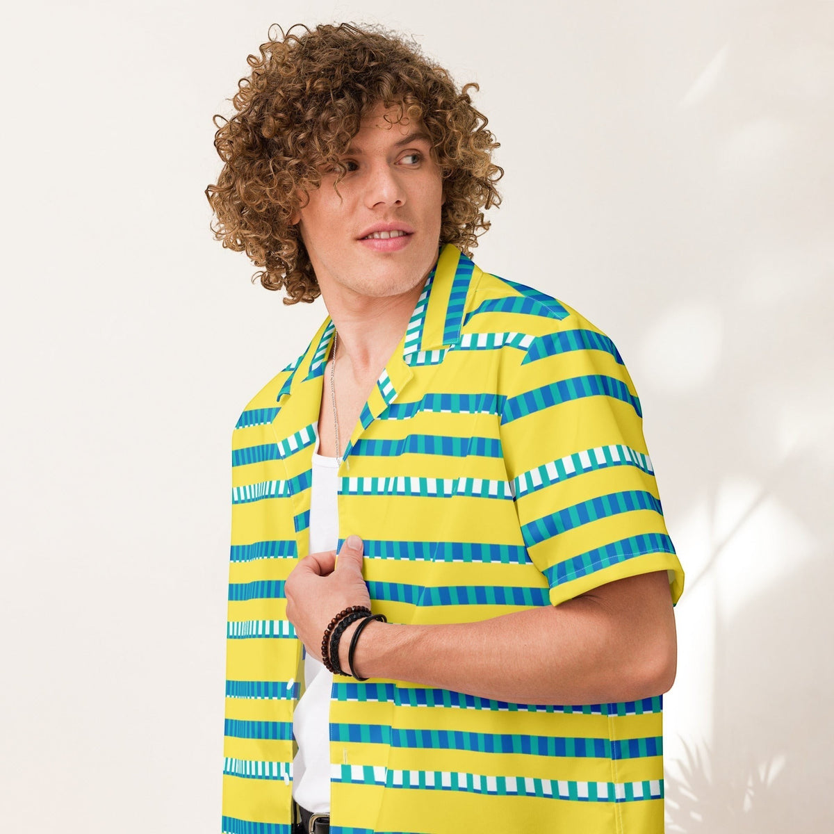 Good Wishes 365 model wearing a yellow, blue, and white striped short sleeve button-up shirt with a camp collar.