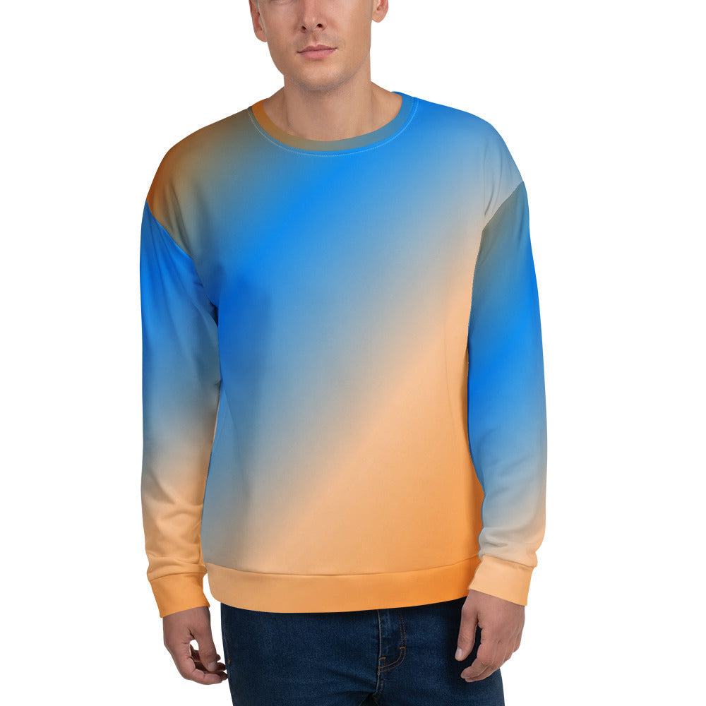 Good Wishes 365 unisex crew neck sweatshirt with a vibrant blue and orange sunset gradient print on a male model.